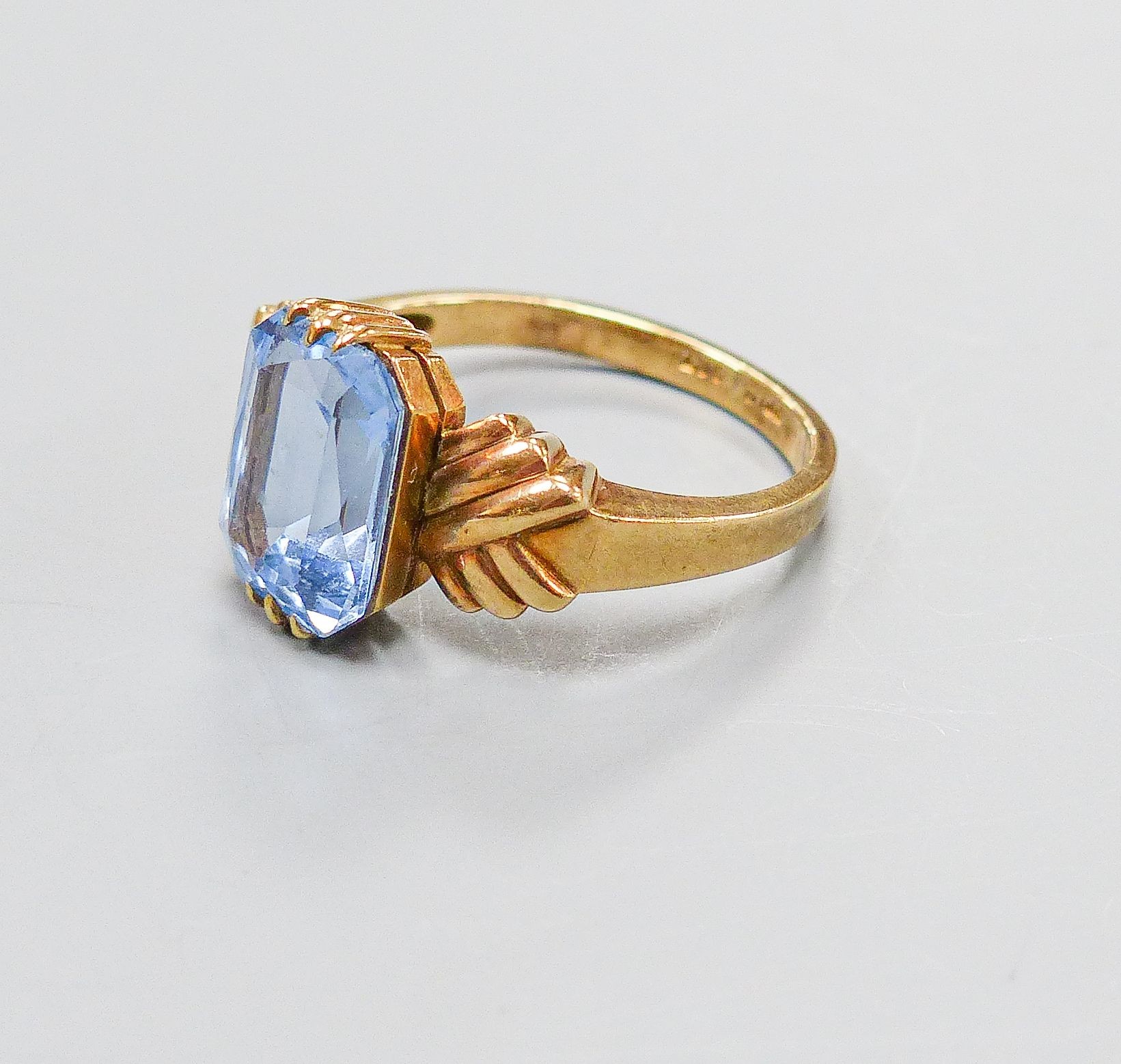 A 9ct and blue paste set dress ring, size O, gross weight 3.8 grams.